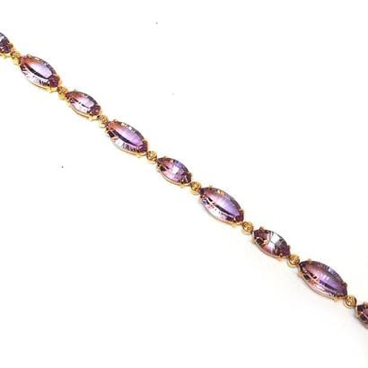 BRACELET articulé en argent doré (vermeil)...