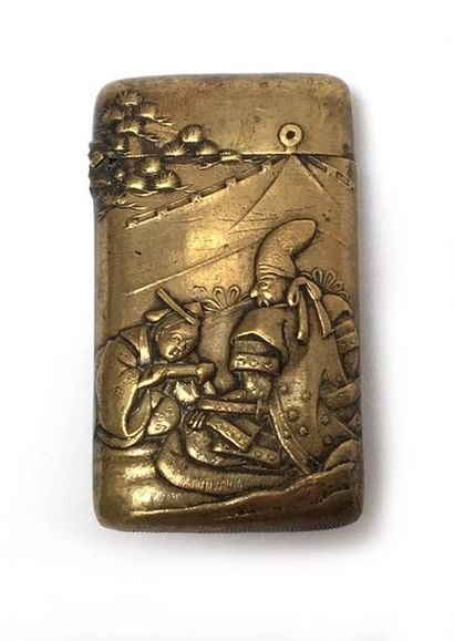 Gilt copper case with relief decoration of...