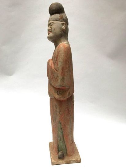 Eunuch standing on a base with his hands...