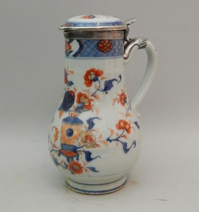 Porcelain covered jug decorated with two...