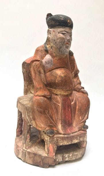 Dignitary seated reliquary in polychrome...