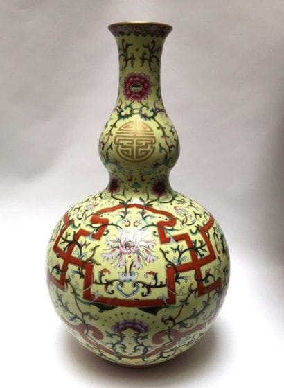 Double vase with yellow porcelain bottom....