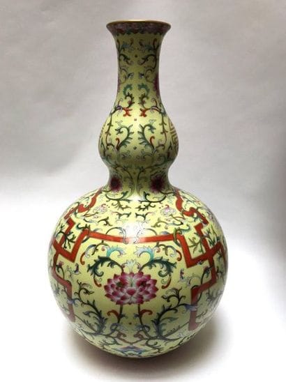 Double vase with yellow porcelain bottom....