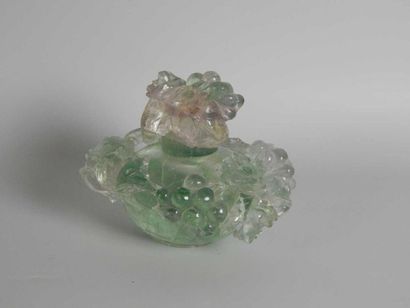 Fluorite bottle with floral decoration. China,...