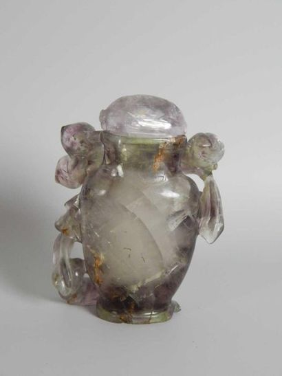 Amethyst bottle with floral decoration. China,...