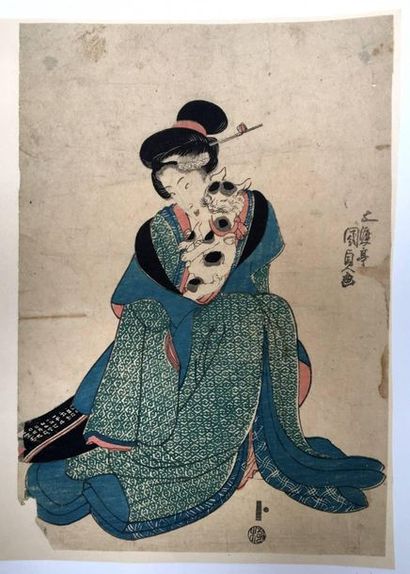 Kunisada. Jeune femme debout tenant un chat...