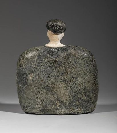 Composite statuette. The character is sitting,...