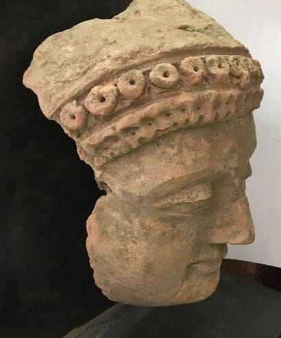 Raw clay adoring face. 
 
Greco-Buddhist...