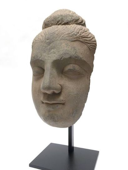 Buddha's face with fine curls, made of shale....