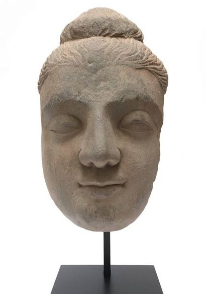 Buddha's face with fine curls, made of shale....