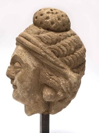 Stucco maid's head. 
 
Greco-Buddhist Art...