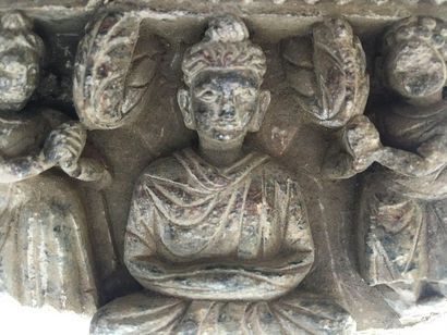 Fragment of a schist frieze carved by Buddhas....