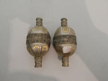Two ovoid-shaped necklace elements made of...