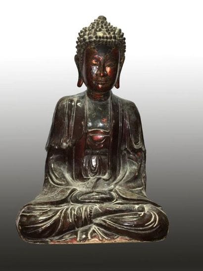 Buddha sitting in the position of 