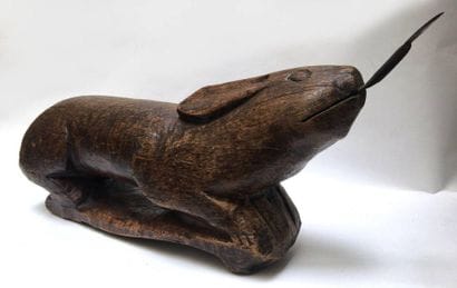 Wooden rabbit-shaped coconut breaker or grater....
