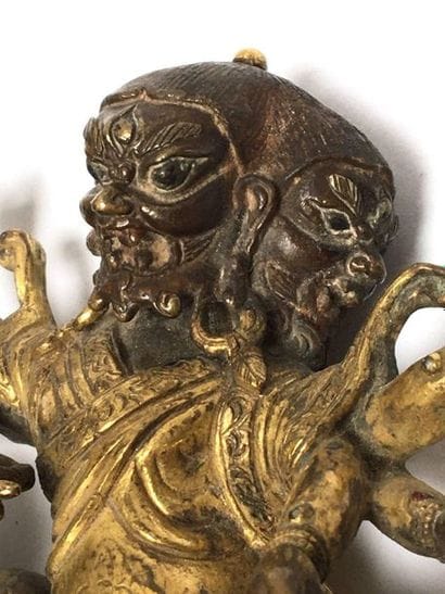 Guardian God with three heads and six arms,...