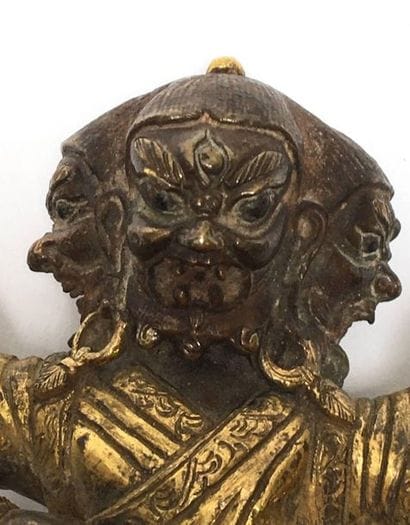 Guardian God with three heads and six arms,...
