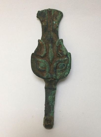 Curious classical bronze fibula with green...