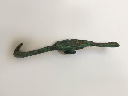 Curious classical bronze fibula with green...
