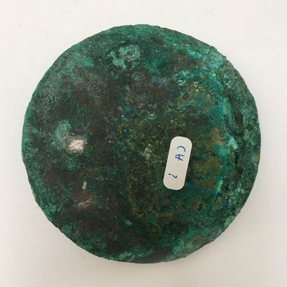Bronze mirror with green patina, decorated...