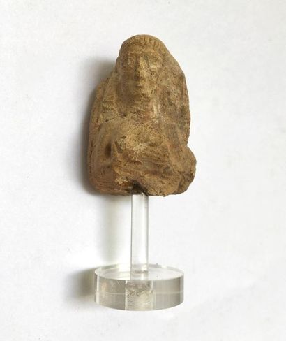 Bust of Astrate holding his breasts.

Around...