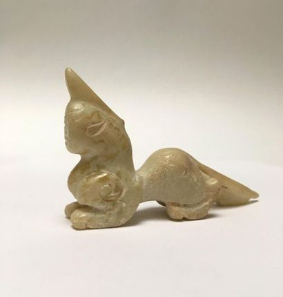Mythical animal in beige jade. Body of a...