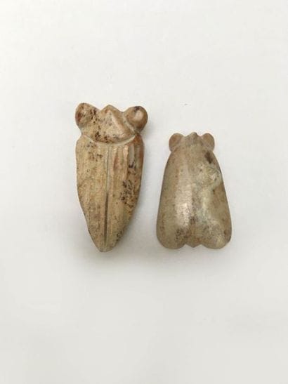 Two green/yellow jade cicadas. Formerly worn...