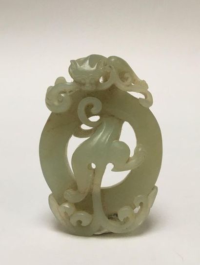 Pale green jade pendant. It represents a...