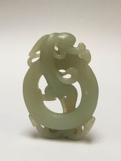 Pale green jade pendant. It represents a...