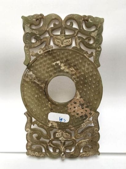 BI disk with four dragons facing each other,...