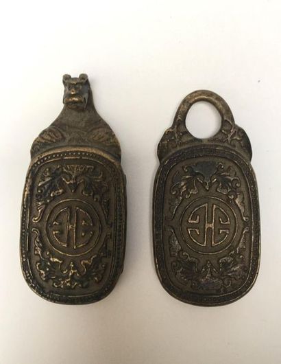 Bronze belt buckle decorated with monograms...