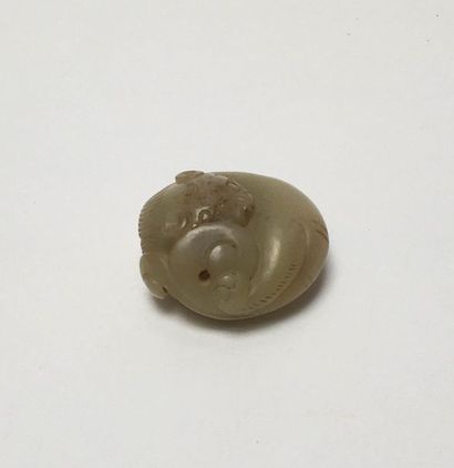 Cat rolled into a ball carved in a stone...