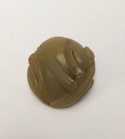 Cat rolled into a ball carved in a stone...