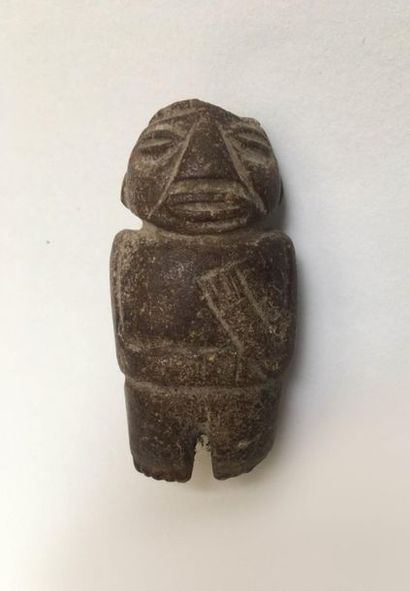Small anthropomorphic idol made of brown...