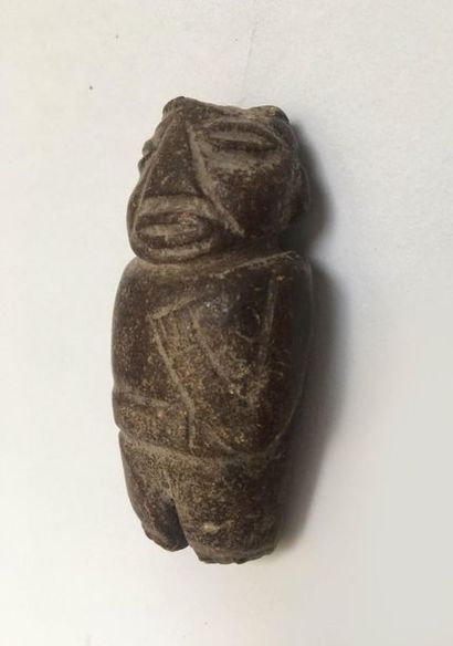 Small anthropomorphic idol made of brown...