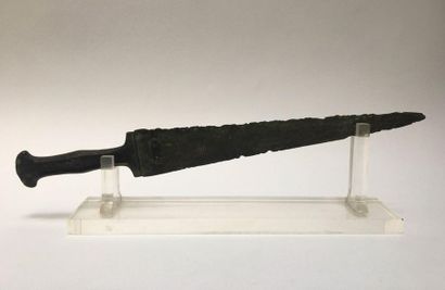 Bronze dagger with green patina. Guard decorated...