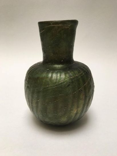 Iridescent glass vase with moulded decoration....