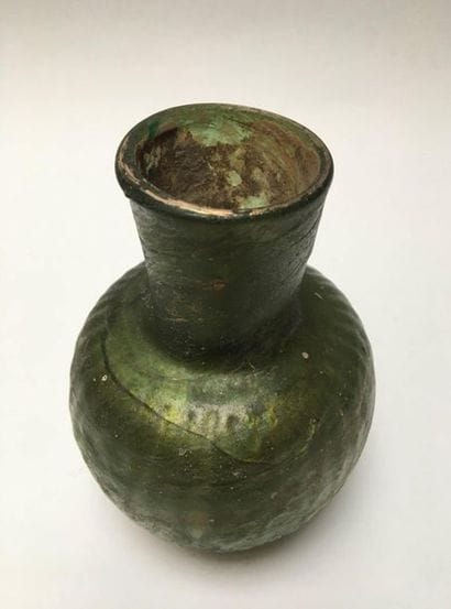 Iridescent glass vase with moulded decoration....