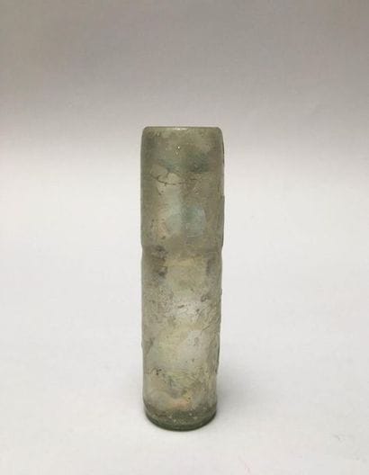 Iridescent glass vase of tubular shape.

Islamic...