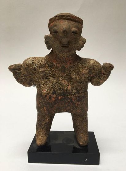 Statue showing a standing woman wearing a...