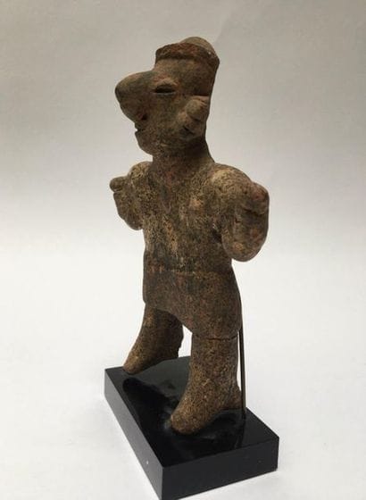 Statue showing a standing woman wearing a...