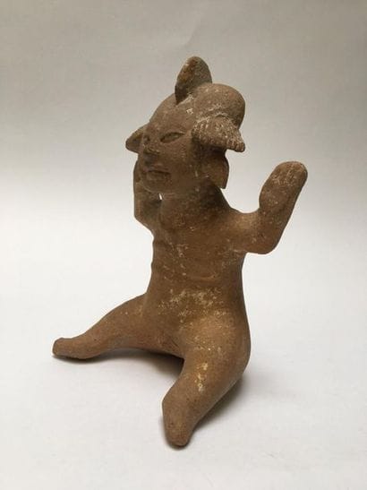 Male character in beige terracotta. He is...