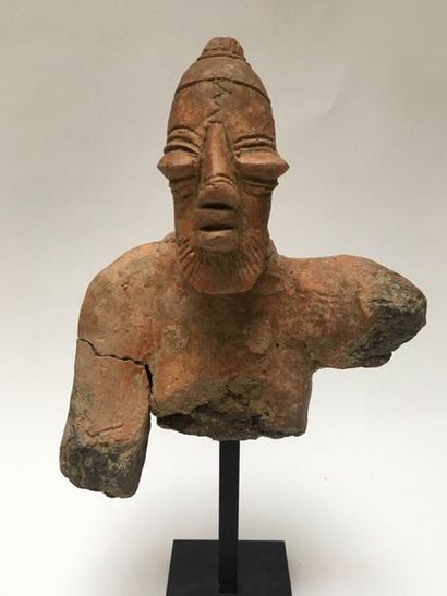 Fragmentary bust of a man with a neat beard;...
