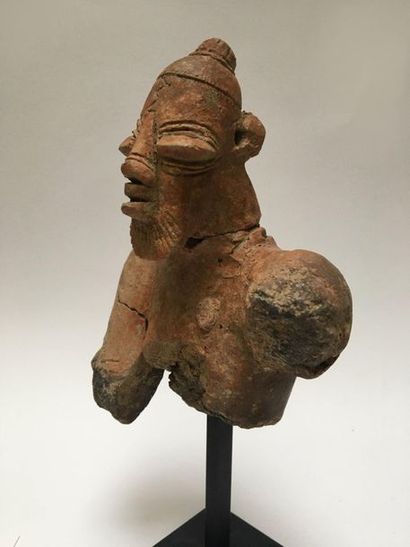 Fragmentary bust of a man with a neat beard;...