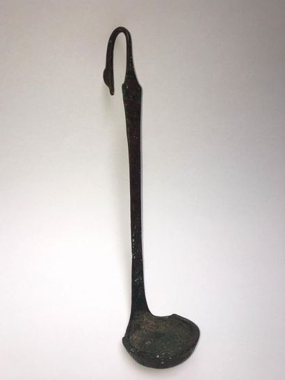 Simpulum whose handle is decorated with a...