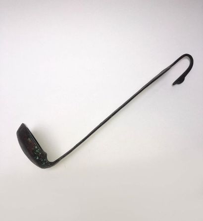 Simpulum whose handle is decorated with a...