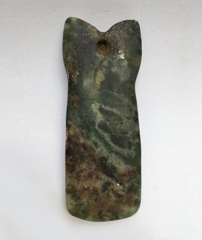 Jade axe representing a stylized character...