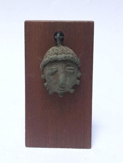 Pendant presenting a small protective portrait...