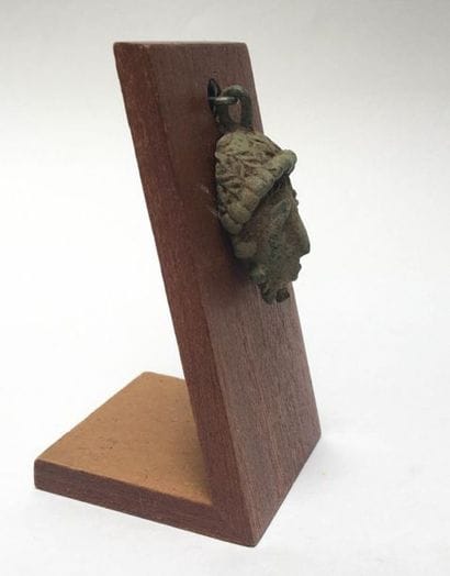 Pendant presenting a small protective portrait...
