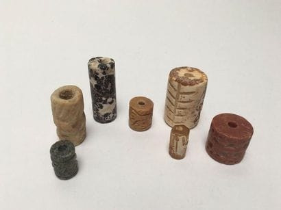 Set of seven engraved cylinder seals decorated...